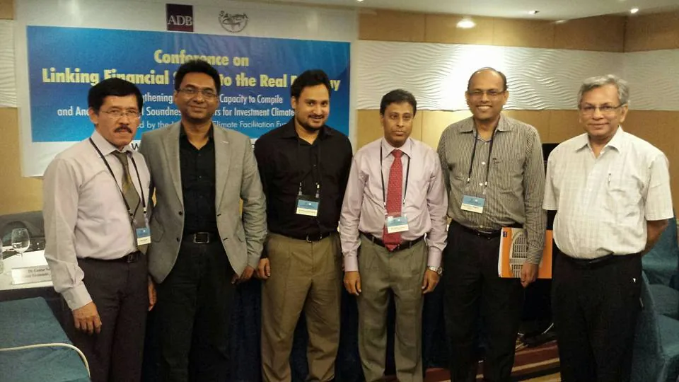 Conference on Linking Financial Sector to the Real Economy: participants at the banner · Dhaka · 2014
